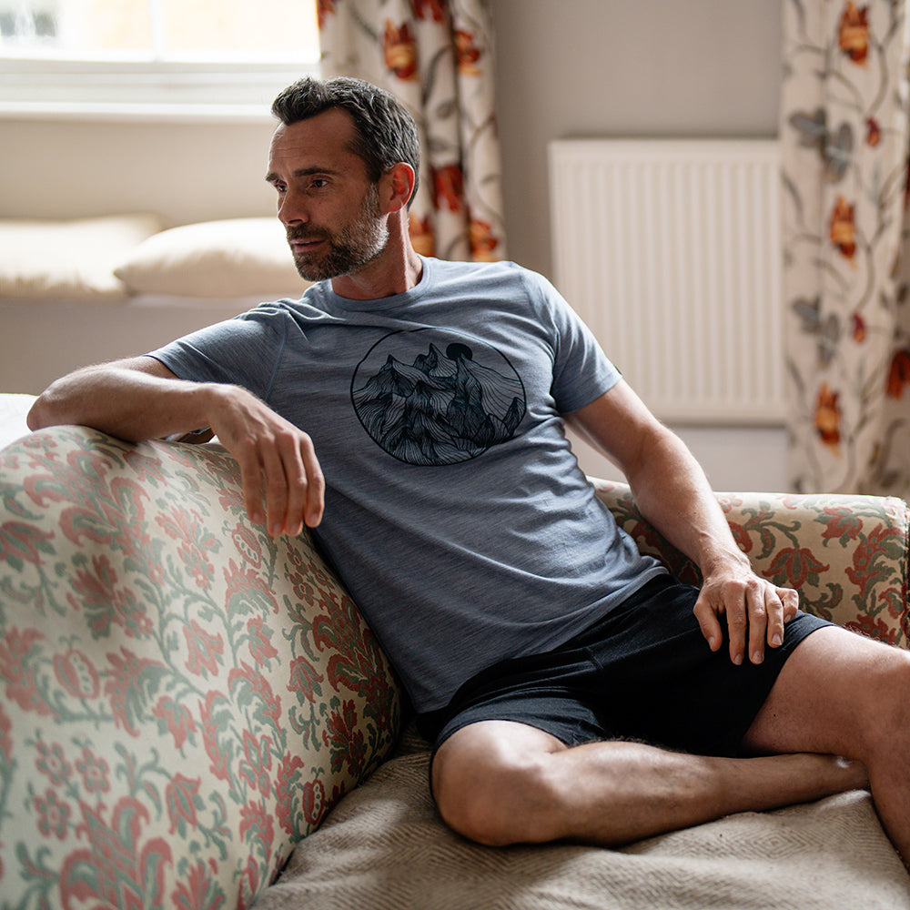 Isobaa | Mens Merino 150 Mountains Tee (Sky/Petrol) | Gear up for adventure with our superfine Merino Tee. | Model: Ben