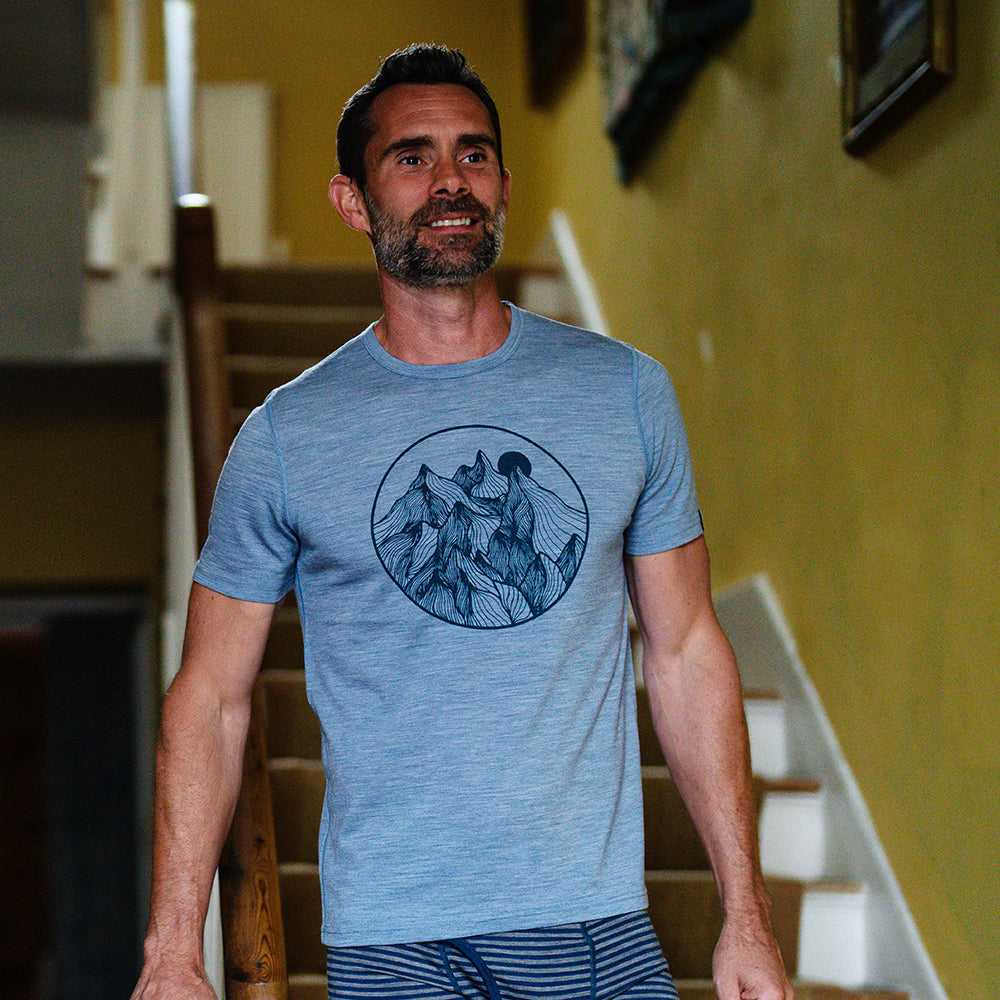 Isobaa | Mens Merino 150 Mountains Tee (Sky/Petrol) | Gear up for adventure with our superfine Merino Tee. | Model: Ben