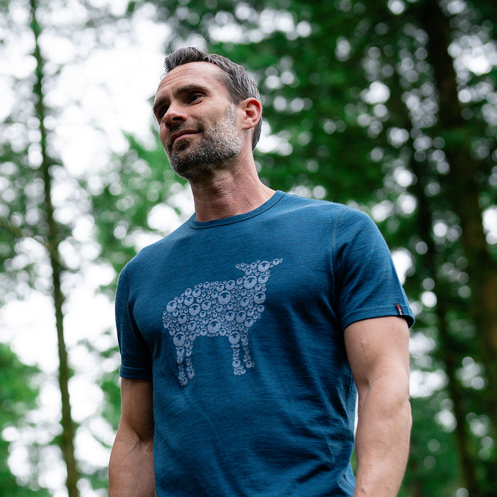Isobaa | Mens Merino 150 Sheep Tee (Petrol/Sky) | Gear up for everyday adventures in Isobaa's superfine Merino Tee. | Model: Ben