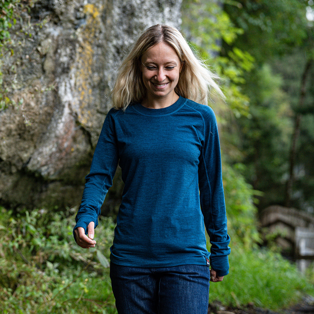 Isobaa | Womens 160 Merino Active Long Sleeve Crew (Petrol) | Elevate your active wardrobe with our Women's 160 Merino Active Long Sleeve Crew, expertly crafted from 160g 18.5 micron superfine merino wool | Model: Estelle