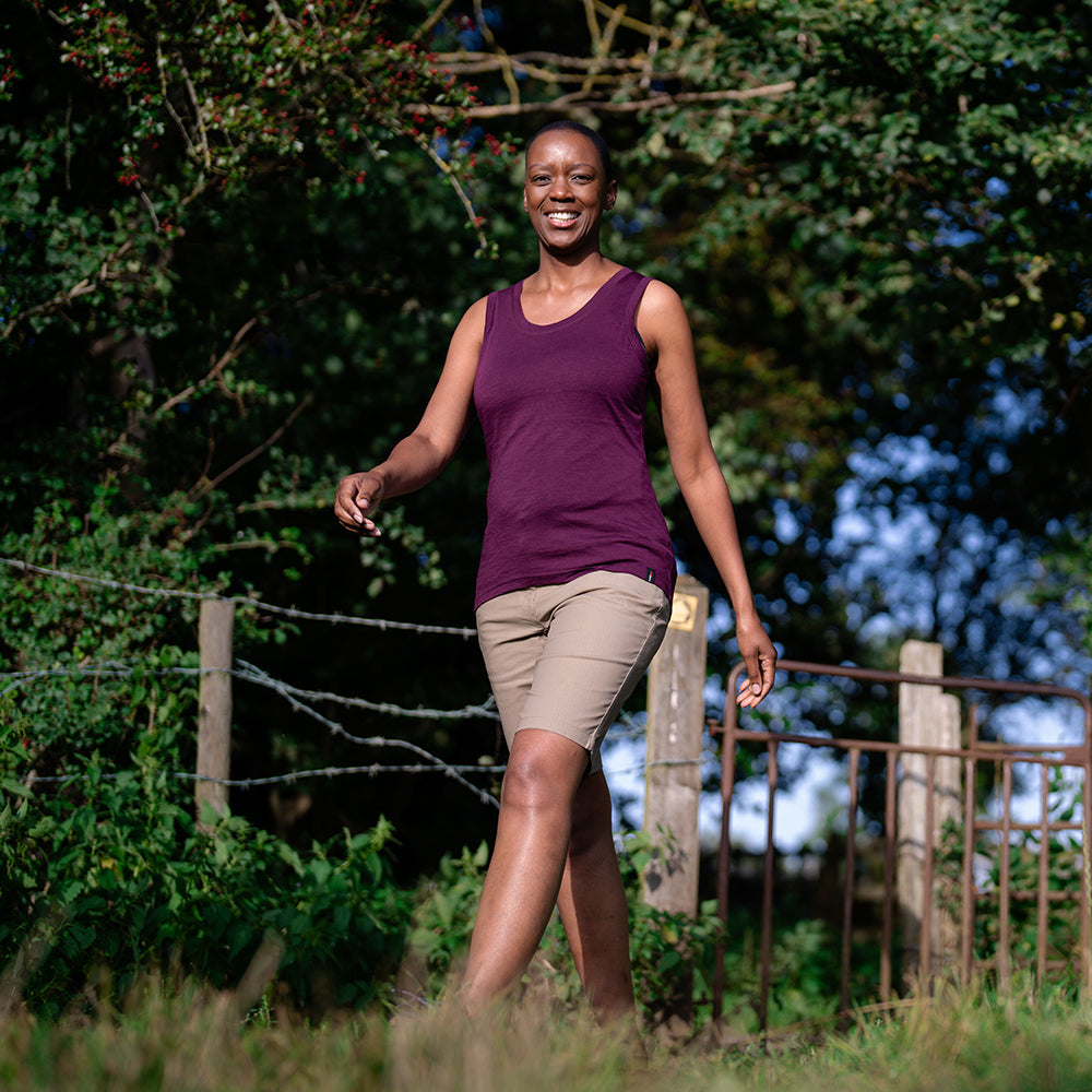 Isobaa | Womens Merino 150 Vest (Wine) | Be ready for any adventure with Isobaa's superfine Merino sleeveless Vest. | Model: Yolisa