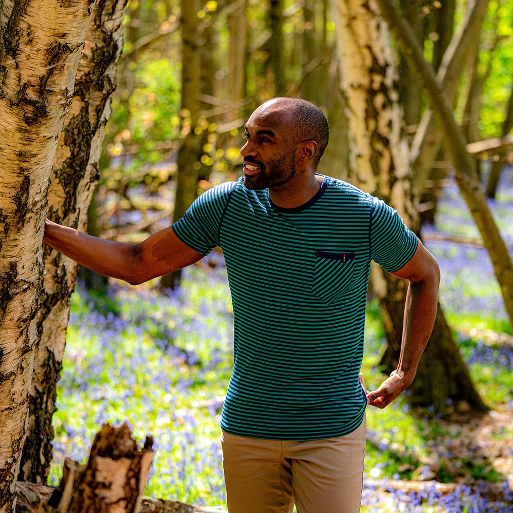 Isobaa | Mens Merino 150 Pocket Tee (Mini Stripe Navy/Green) | Gear up for outdoor adventure with Isobaa's superfine Merino Tee – a perfect blend of comfort, practicality, and sustainable design. | Model: Michael