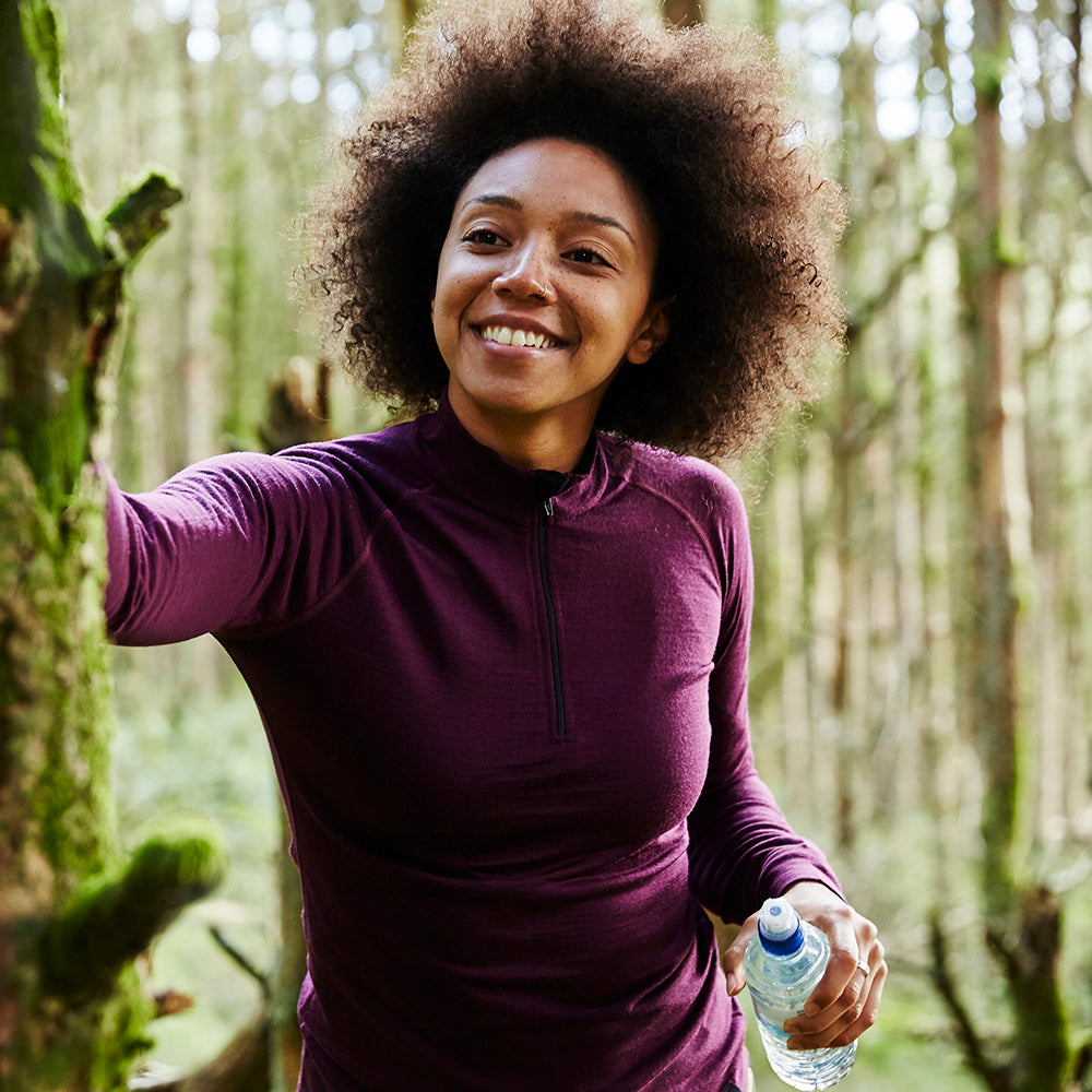 Isobaa | Womens Merino 200 Long Sleeve Zip Neck (Wine) | Experience the best of 200gm Merino wool with this ultimate half-zip top – your go-to for challenging hikes, chilly bike commutes, post-workout layering, and unpredictable weather. | Model: Savanah