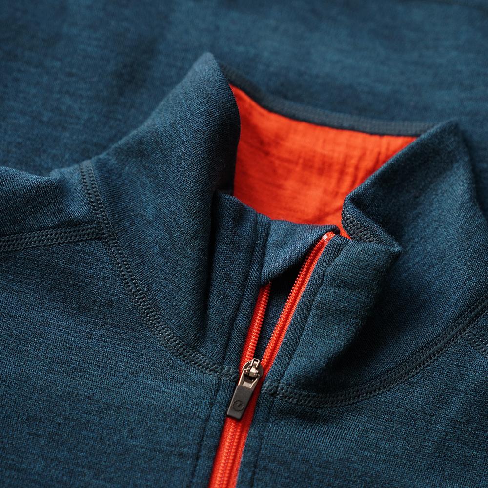 Isobaa | Womens Merino 320 Long Sleeve Half Zip (Petrol/Orange) | Conquer cold trails, blustery commutes, and unpredictable weather with the ultimate Merino wool half-zip top.
