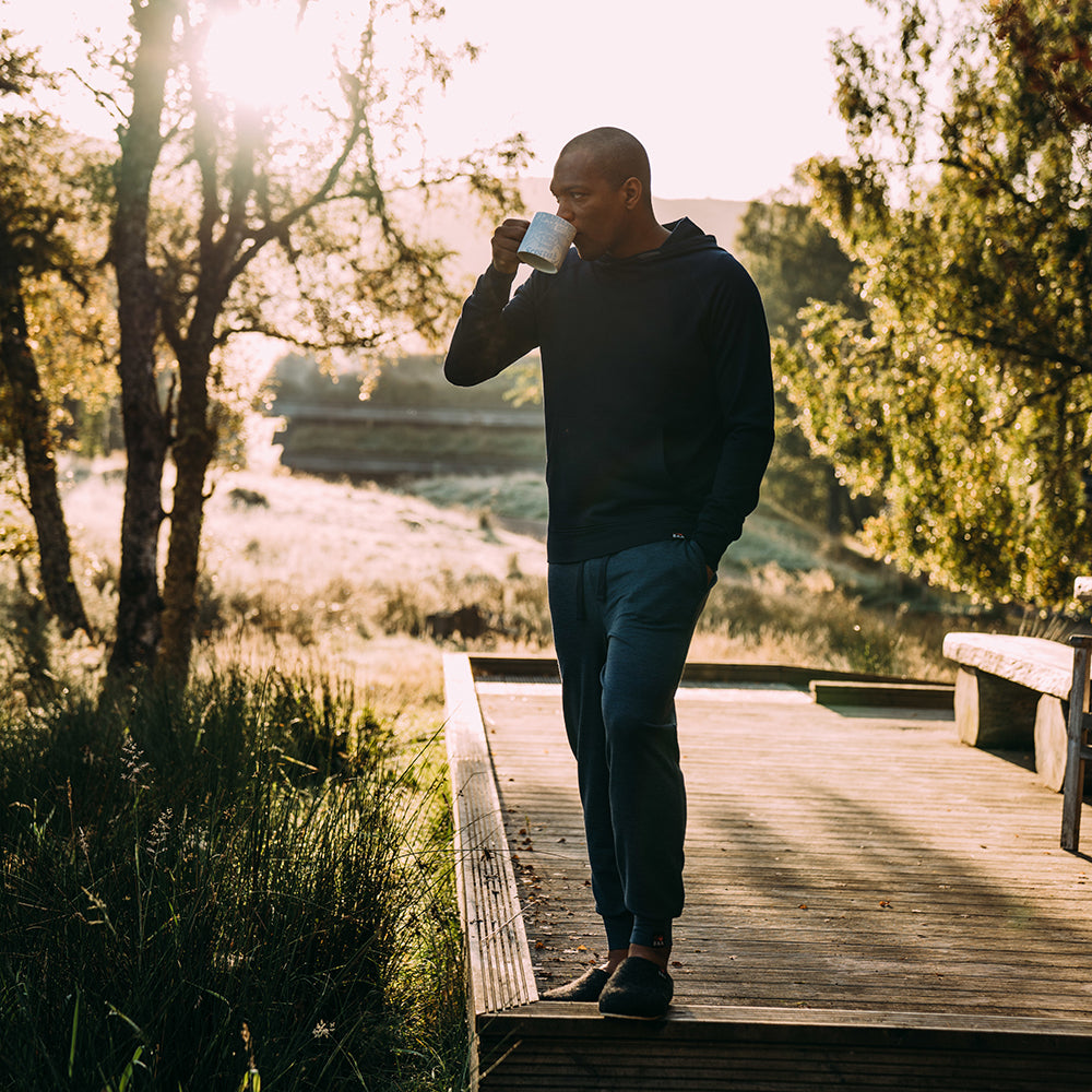 Isobaa | Mens Merino 260 Lounge Cuffed Joggers (Denim/Navy) | Discover unparalleled comfort and versatility with our luxurious 260gm Merino wool lounge joggers. | Model: Edirin