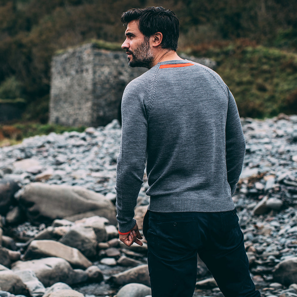 Isobaa | Mens Merino Crew Sweater (Charcoal/Orange) | Everyday warmth and comfort with our superfine 12-gauge Merino wool crew neck sweater. | Model: Duncan