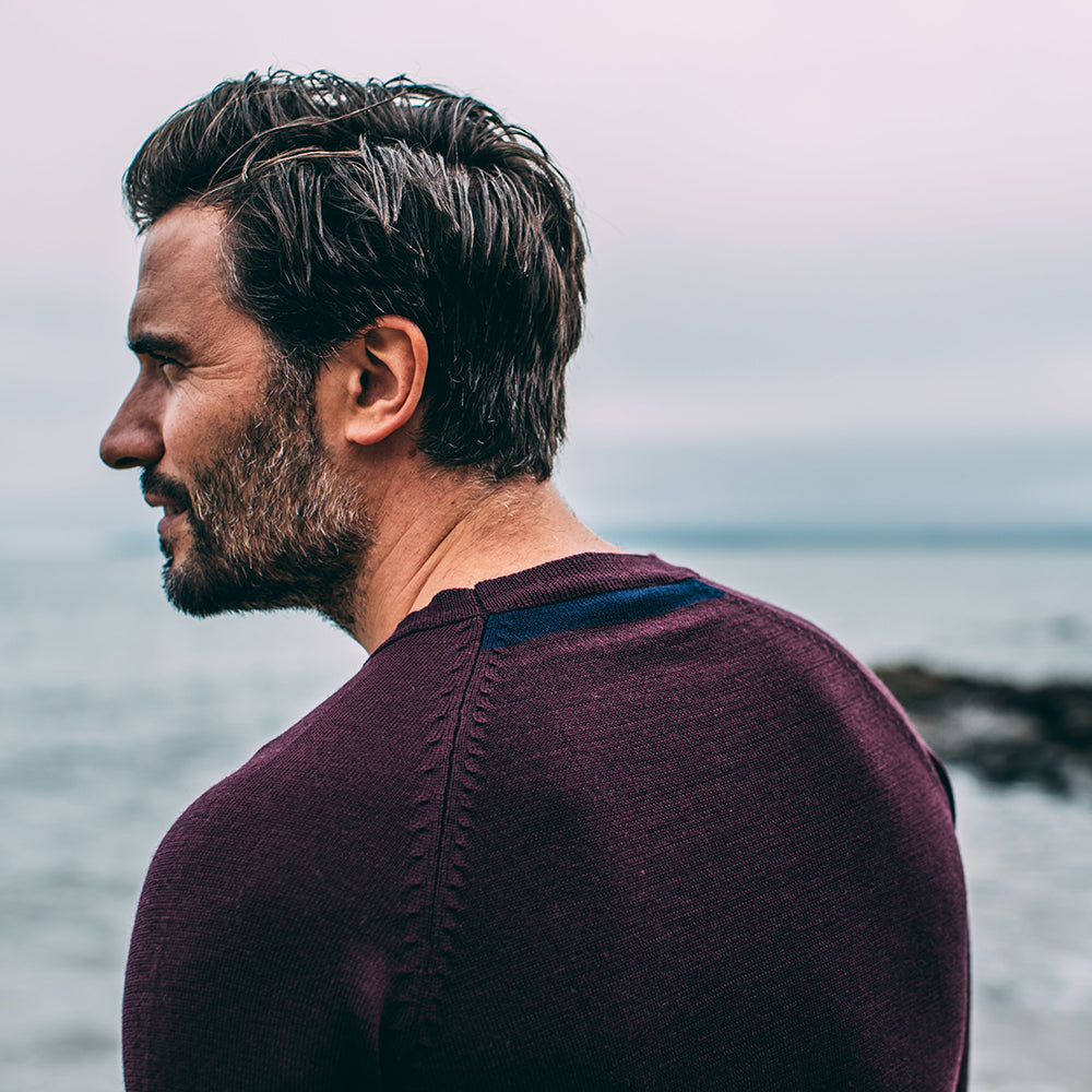 Isobaa | Mens Merino Crew Sweater (Wine/Navy) | Everyday warmth and comfort with our superfine 12-gauge Merino wool crew neck sweater. | Model: Duncan
