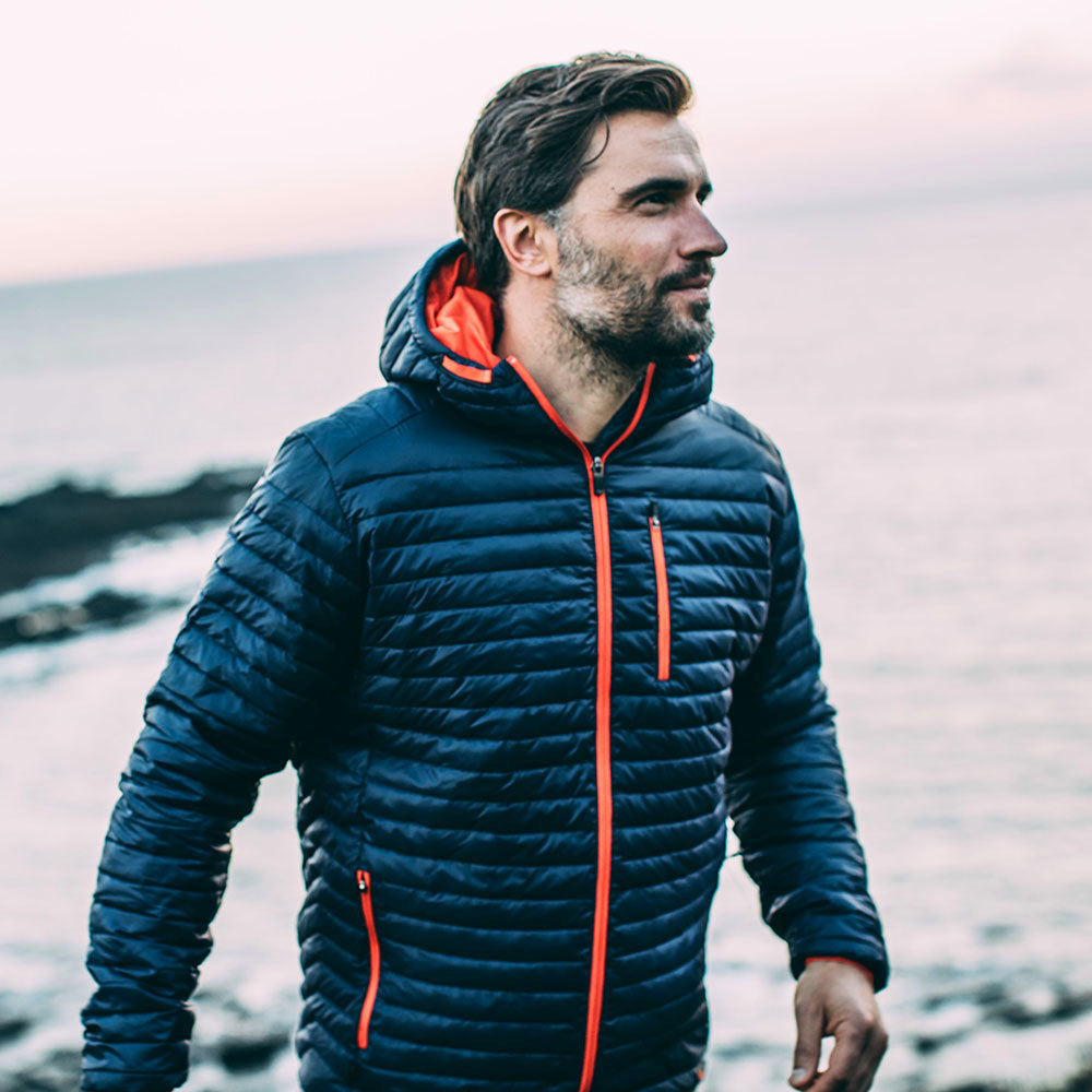 Isobaa | Mens Merino Wool Insulated Jacket (Navy/Orange) | Innovative and sustainable design with our Merino jacket. | Model: Duncan