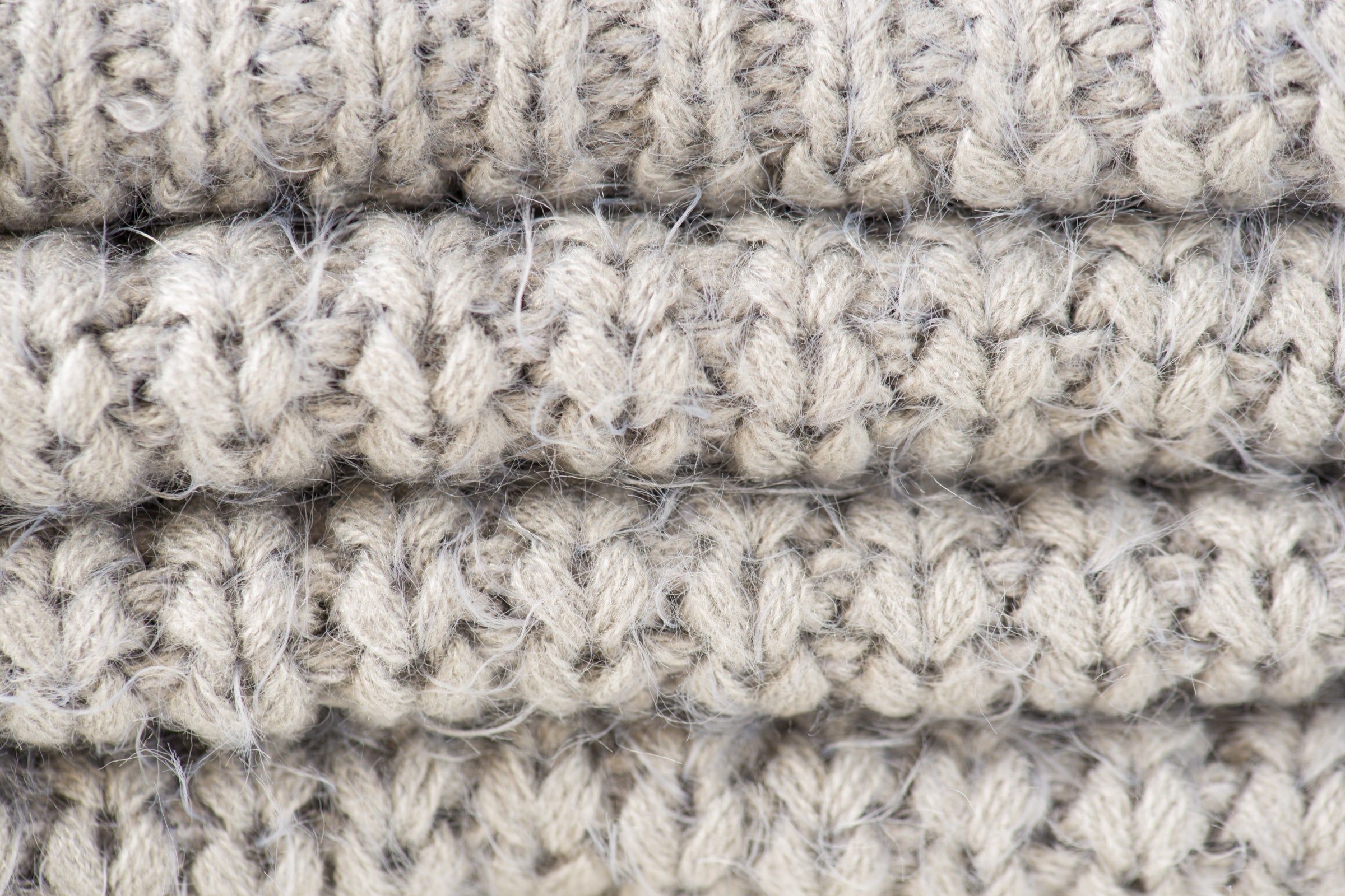 Gros plan sur une texture de tricot en laine épaisse et grossière