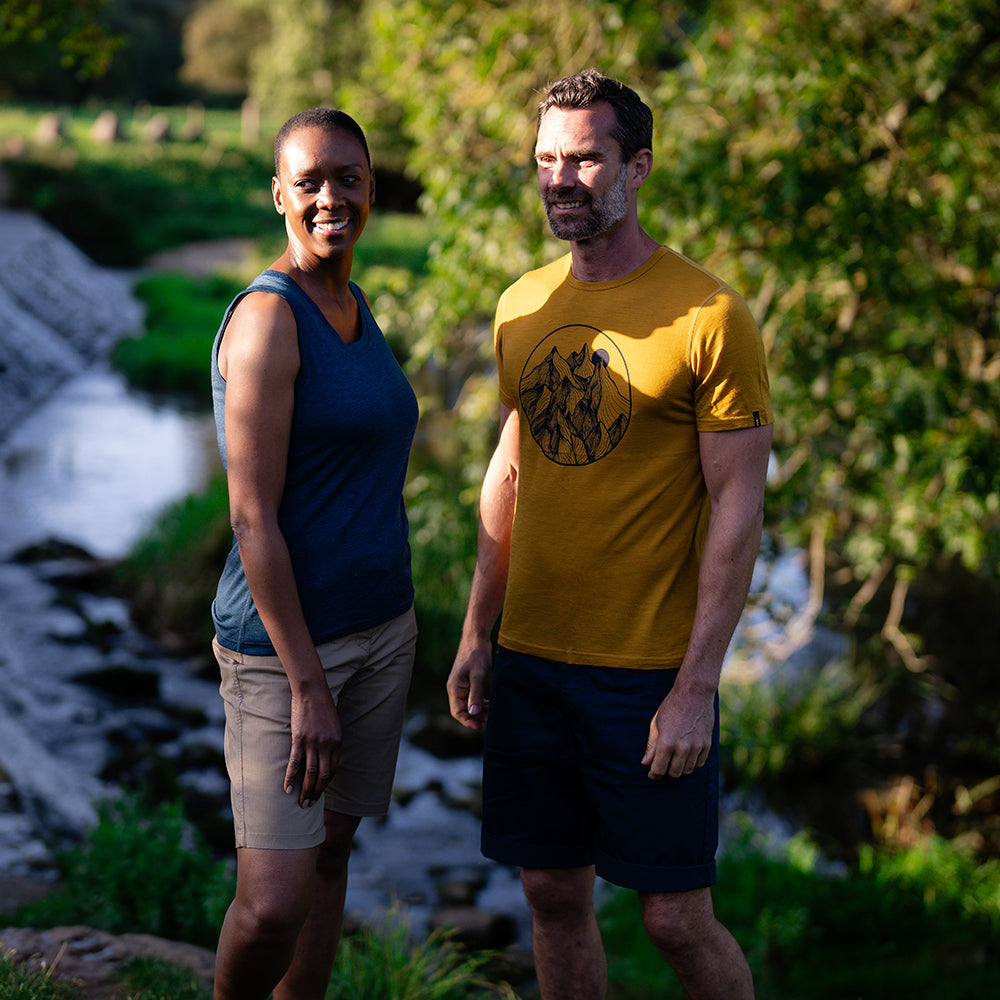 Isobaa | Mens Merino 150 Mountains Tee (Mustard/Navy) | Gear up for adventure with our superfine Merino Tee. | Model: Ben