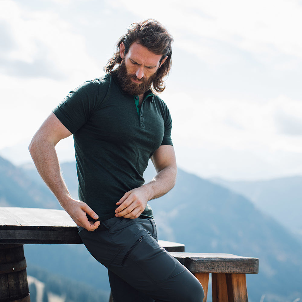Isobaa | Mens Merino 180 Short Sleeve Polo Shirt (Black) | The ultimate Merino wool polo — perfect for weekend hikes, bike commutes, post-adventure coffee stops, office days, and everything in-between. | Model: Craig