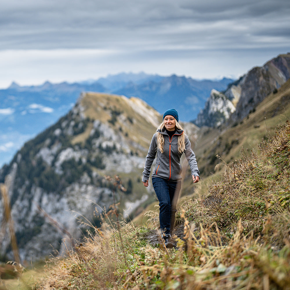 Isobaa | Womens 320 Merino Full Zip (Charcoal/Orange) | Step into a new level of comfort and versatility with our 320 Merino Full Zip Jacket | Model: Estelle