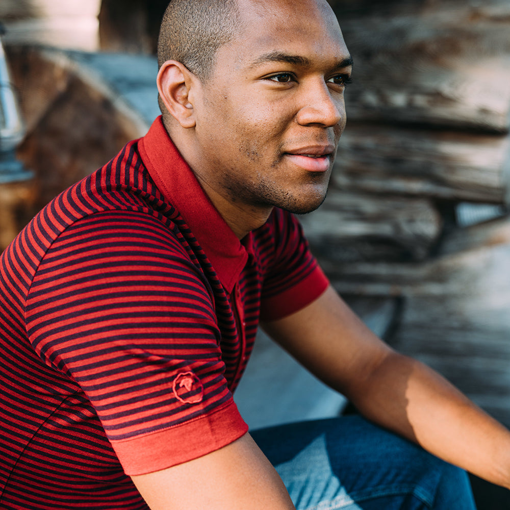 Isobaa | Mens Merino 180 Short Sleeve Polo Shirt (Stripe Red/Wine) | The ultimate Merino wool polo  – perfect for weekend hikes, bike commutes, post-adventure coffee stops, office days, and everything in-between. | Model: Edirin