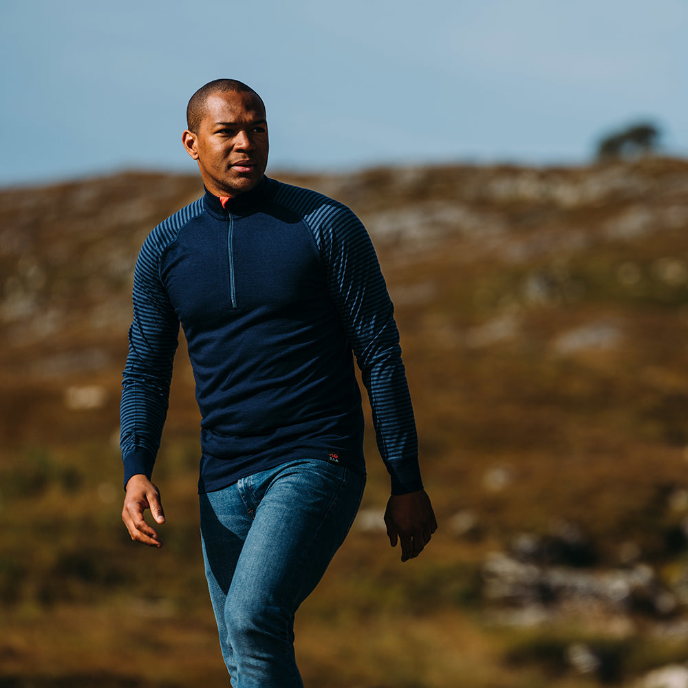 Isobaa | Mens Merino 200 Long Sleeve Zip Neck (Stripe Navy/Denim) | Experience the best of 200gm Merino wool with this ultimate half-zip top – your go-to for challenging hikes, chilly bike commutes, post-workout layering, and unpredictable weather. | Model: Edirin
