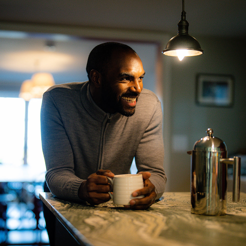 Isobaa | Mens Merino Zip Sweater (Charcoal Melange) | Discover exceptional warmth, comfort, and everyday versatility with our extrafine Merino wool sweater. | Model: Michael