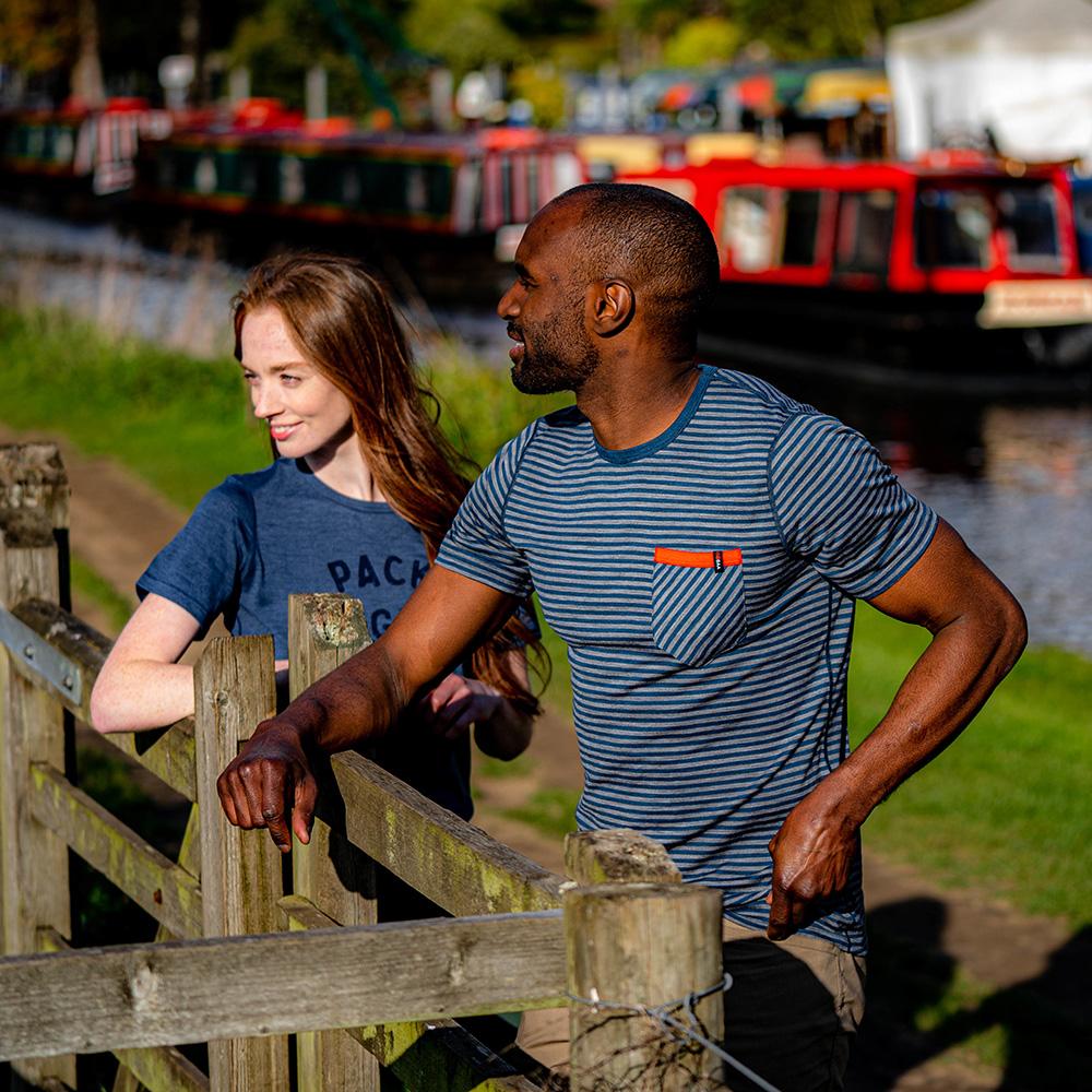Isobaa | Mens Merino 150 Pocket Tee (Mini Stripe Petrol/Charcoal) | Gear up for outdoor adventure with Isobaa's superfine Merino Tee – a perfect blend of comfort, practicality, and sustainable design. | Model: Michael
