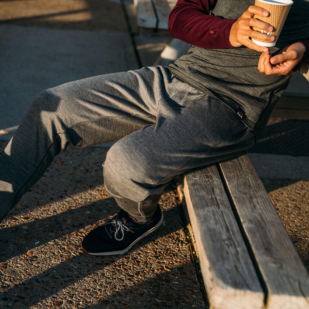 Isobaa | Mens Merino 260 Lounge Cuffed Joggers (Charcoal/Orange) | Discover unparalleled comfort and versatility with our luxurious 260gm Merino wool lounge joggers. | Model: Donald