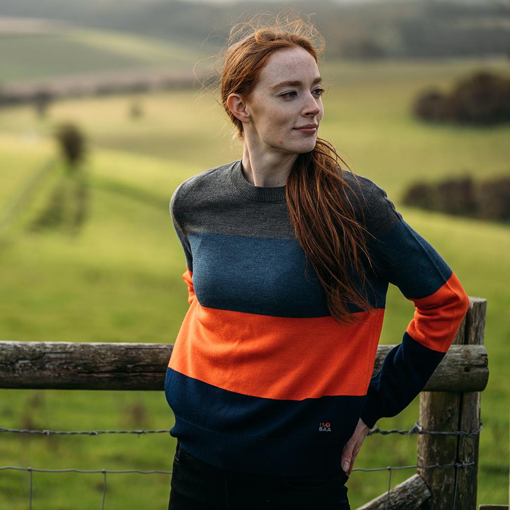 Isobaa | Womens Merino Block Stripe Sweater (Smoke/Denim/Orange/Navy) | Discover effortless style and exceptional comfort with our  extrafine 9-gauge Merino wool crew neck sweater. | Model: Sophie