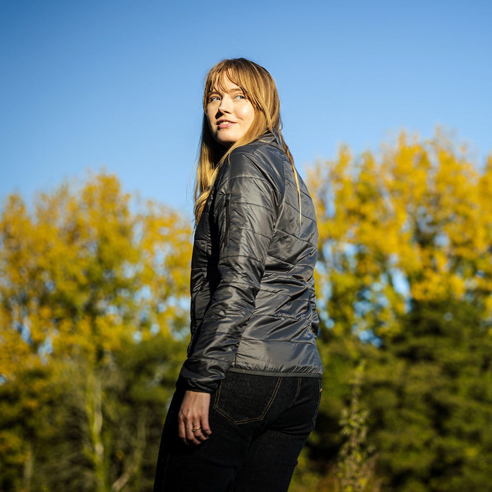 Isobaa | Womens Packable Insulated Jacket (Smoke/Black) | Exceptional warmth, packable convenience, and sustainable design with our lightweight Merino wool jacket. | Model: Natasha